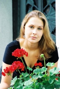 a premenopause woman holding a flower